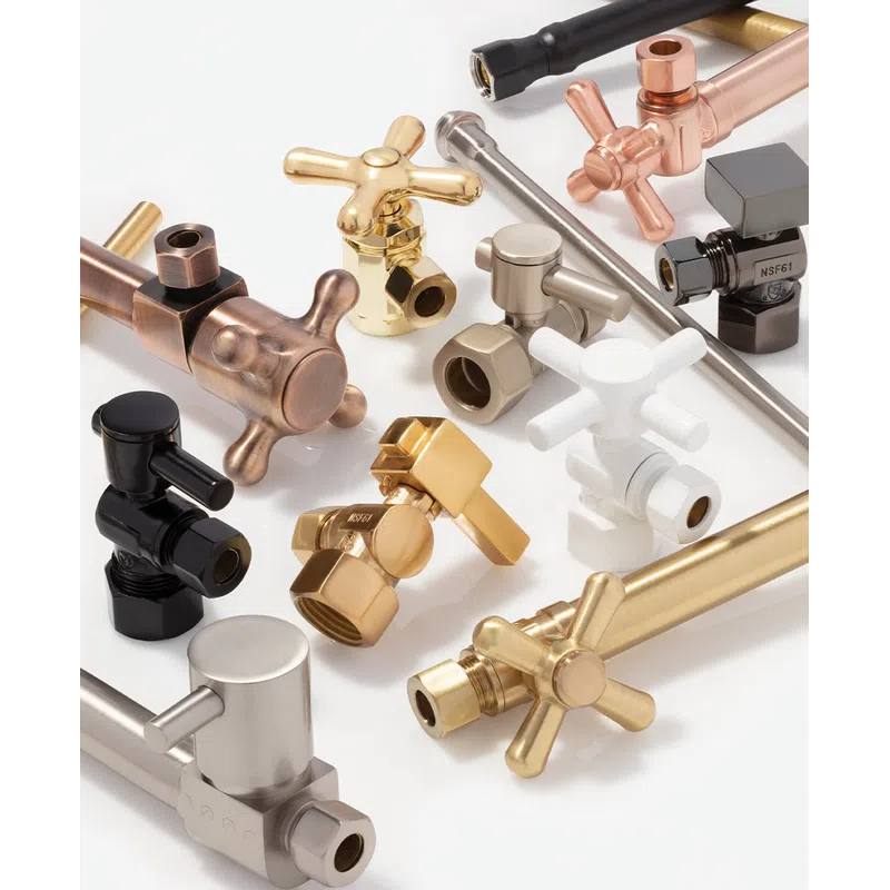 Assorted metal plumbing valves and fittings in gold, silver, black, and copper on white background