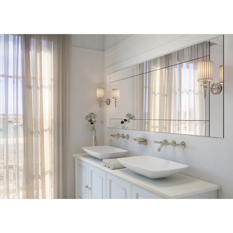 Modern bathroom with dual vessel sinks, large mirror, wall sconces, and sheer curtains letting in natural light