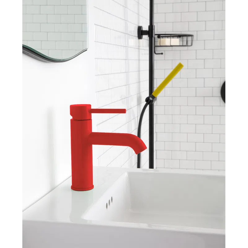 Modern bathroom sink with a bold red faucet against white subway tile walls and a yellow shower handle.