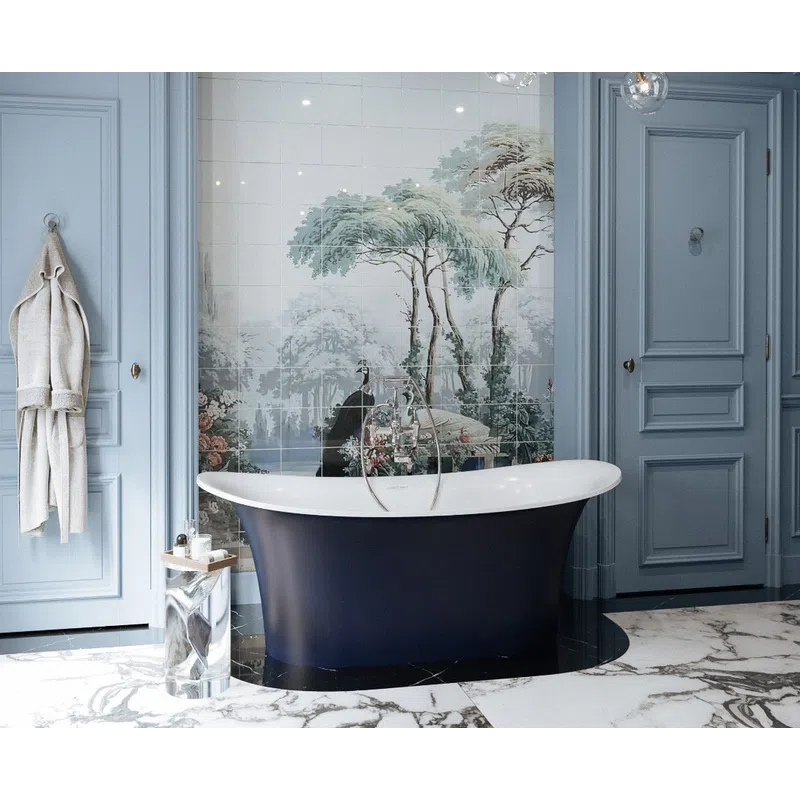 Elegant bathroom with navy freestanding tub, detailed wall mural of trees, blue paneled walls, and modern chandelier