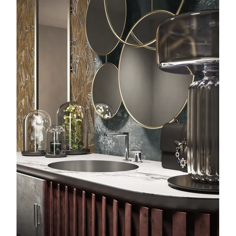 Modern bathroom vanity with marble countertop, round sink, decorative mirrors, and artistic glass domes with plants.