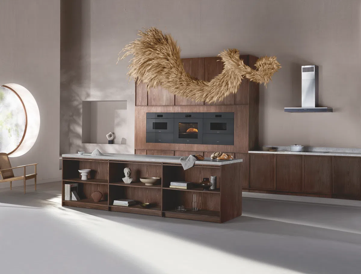 Modern kitchen design featuring wooden cabinetry and artistic decor.