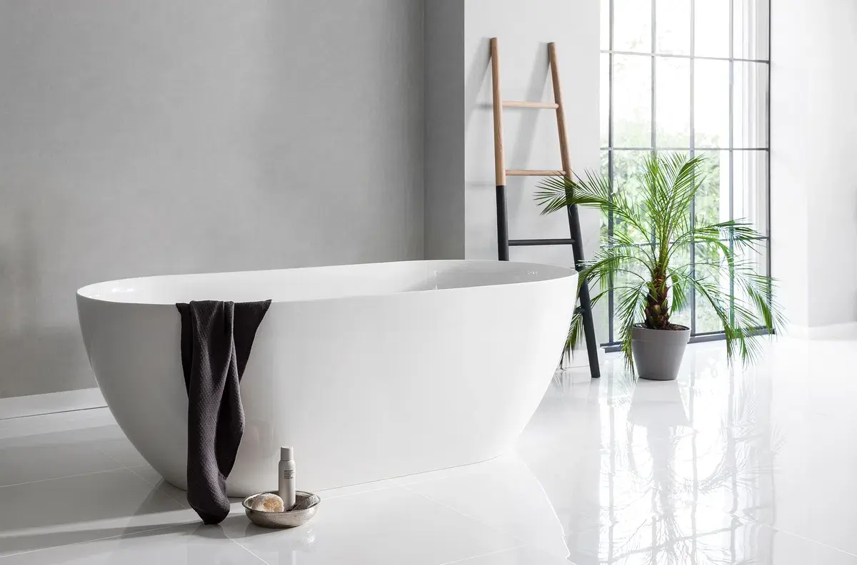 A bathtub with a towel from the side