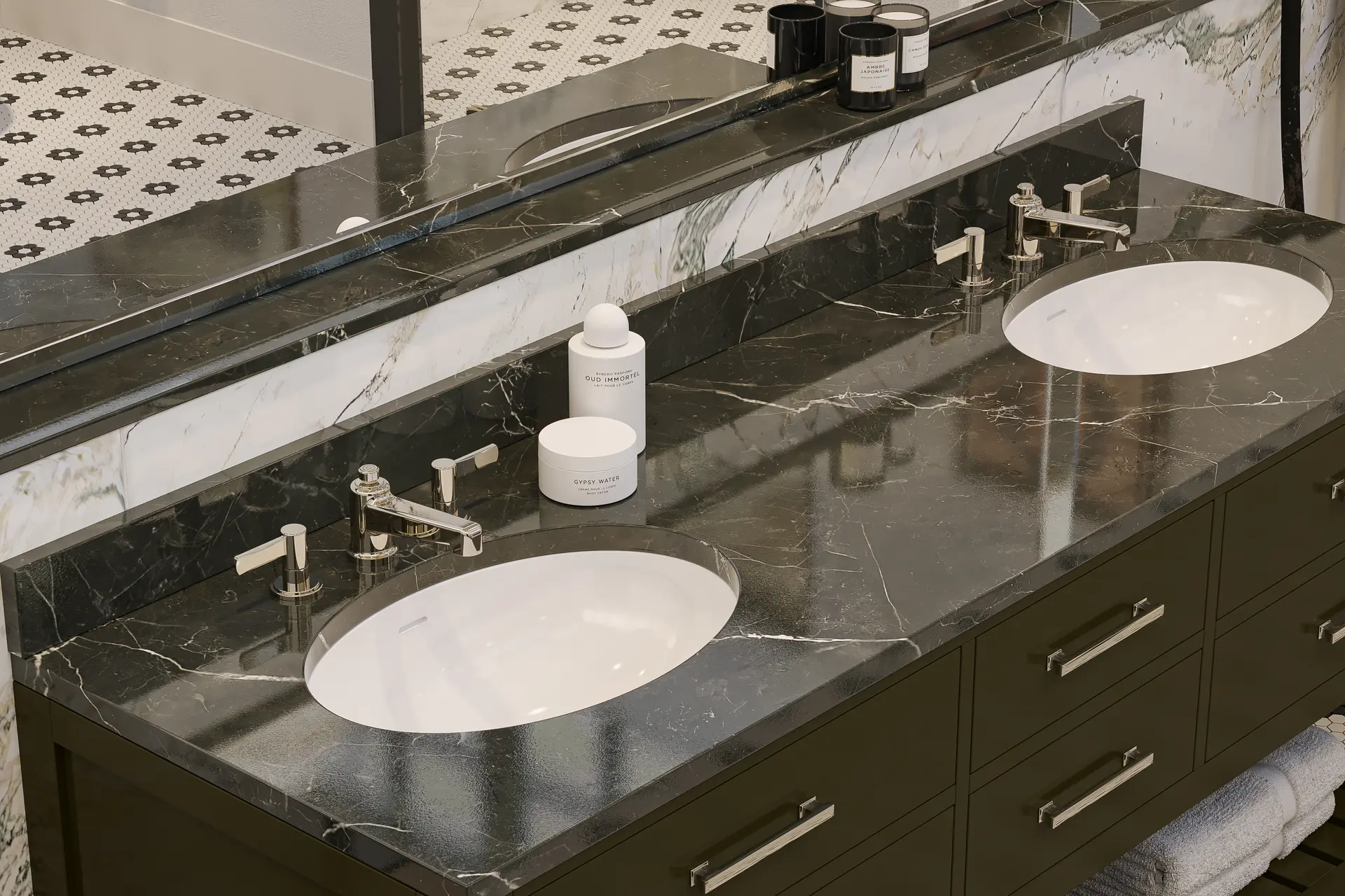 Crosswater Darby widespread faucets on a dark marble double vanity with undermount basins.