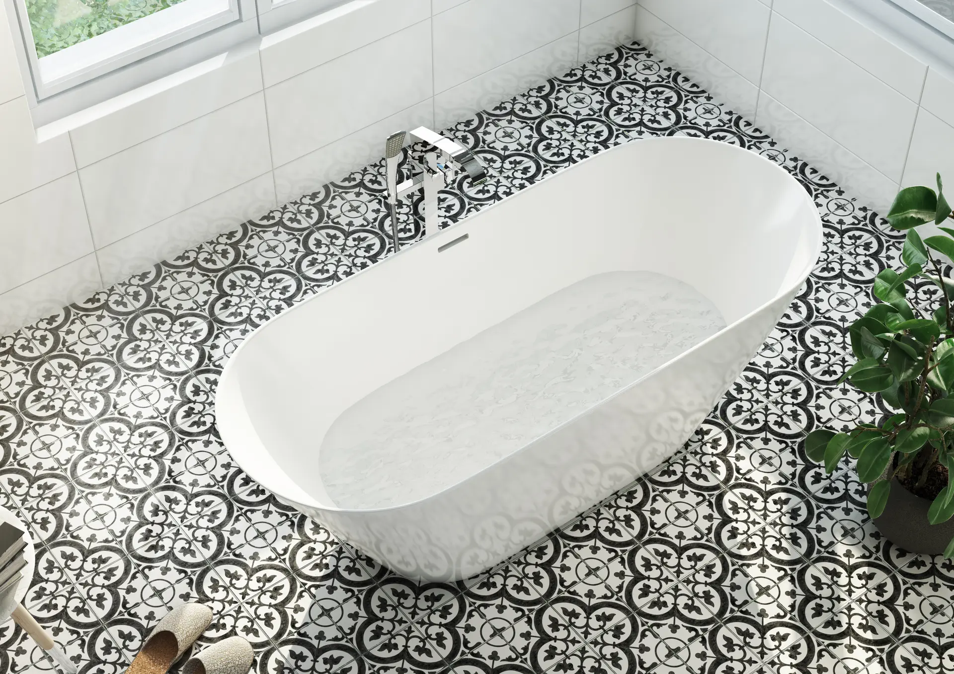Overhead view of a white freestanding tub filling from a Crosswater Leyden faucet on black and white patterned tile.