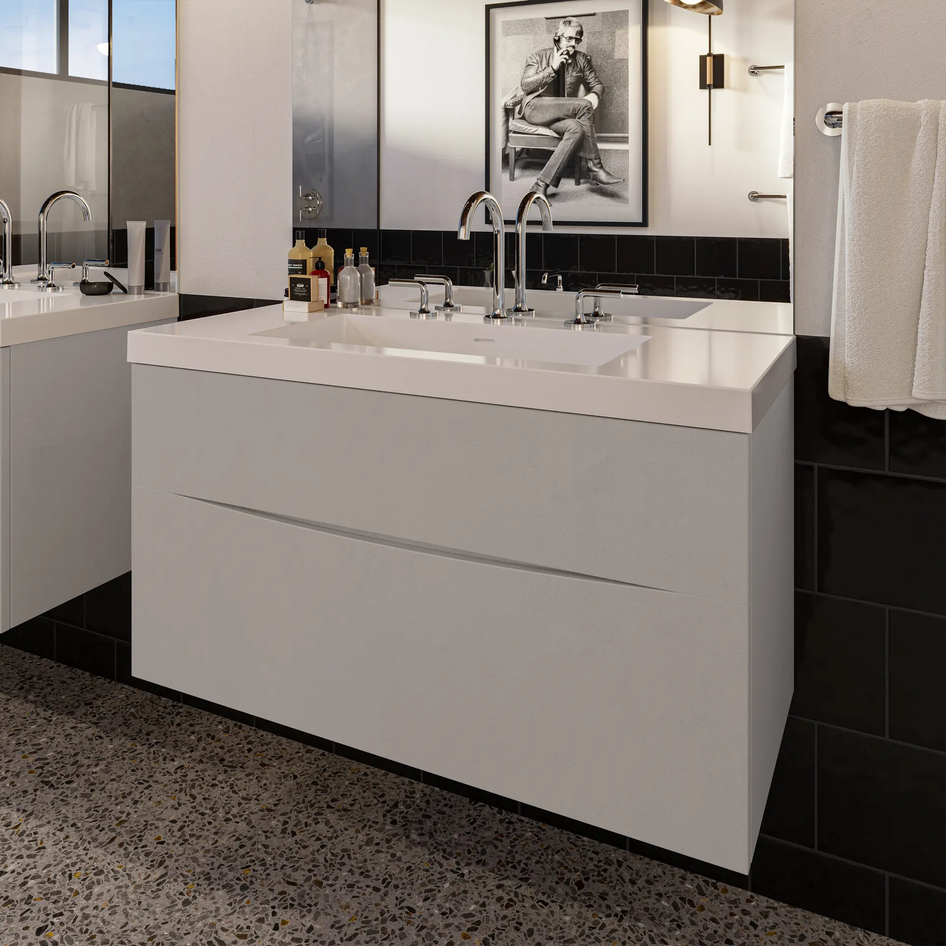 Crosswater Taos floating vanity with a widespread chrome faucet against black and white tile.