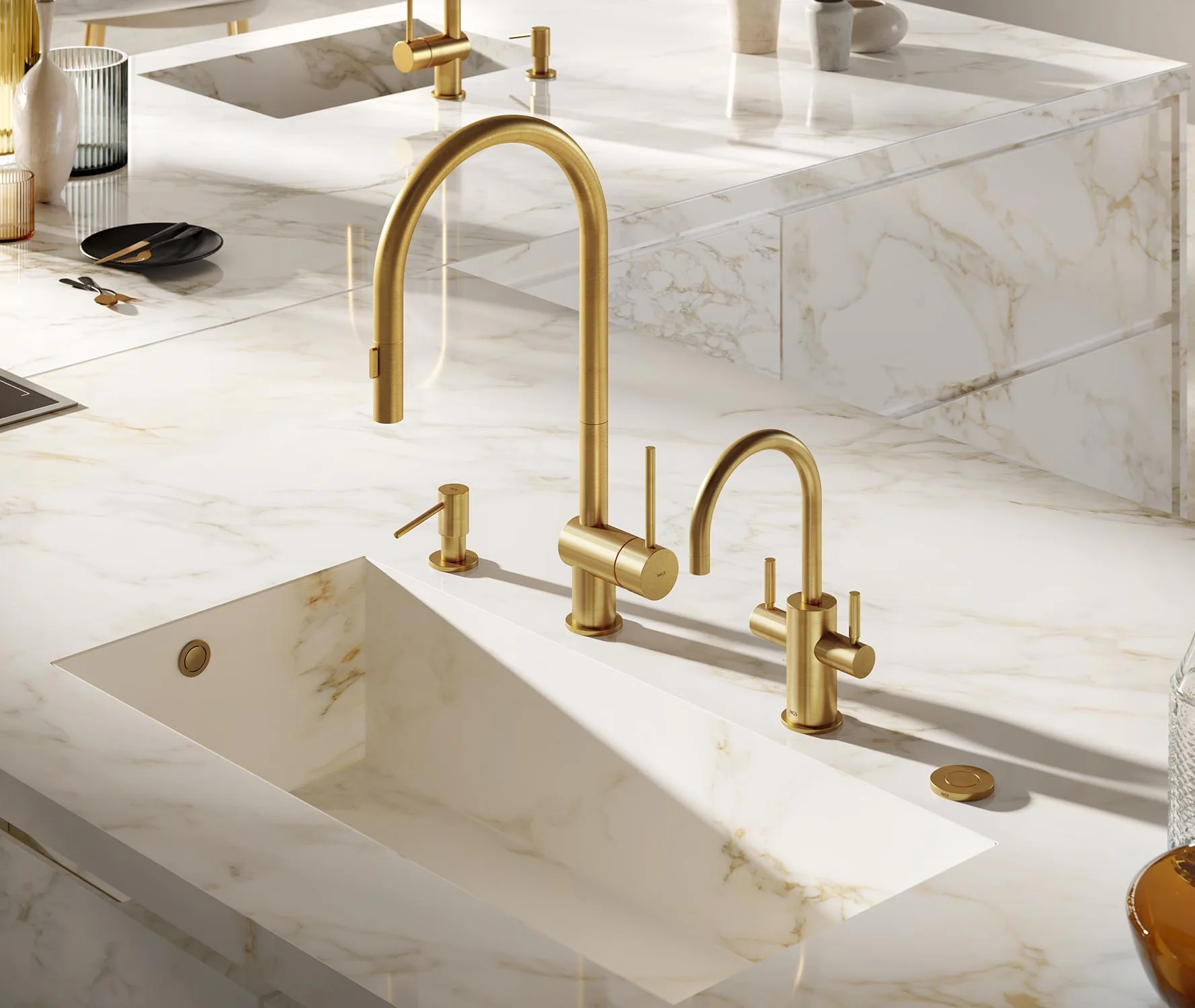 Brushed brass MGS faucet and soap dispenser on an integrated Calacatta marble sink